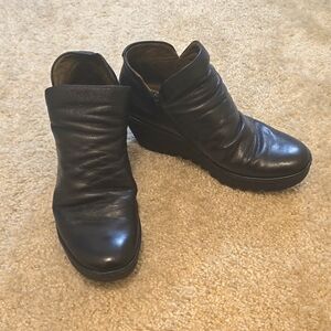 Fly London black leather wedge booties